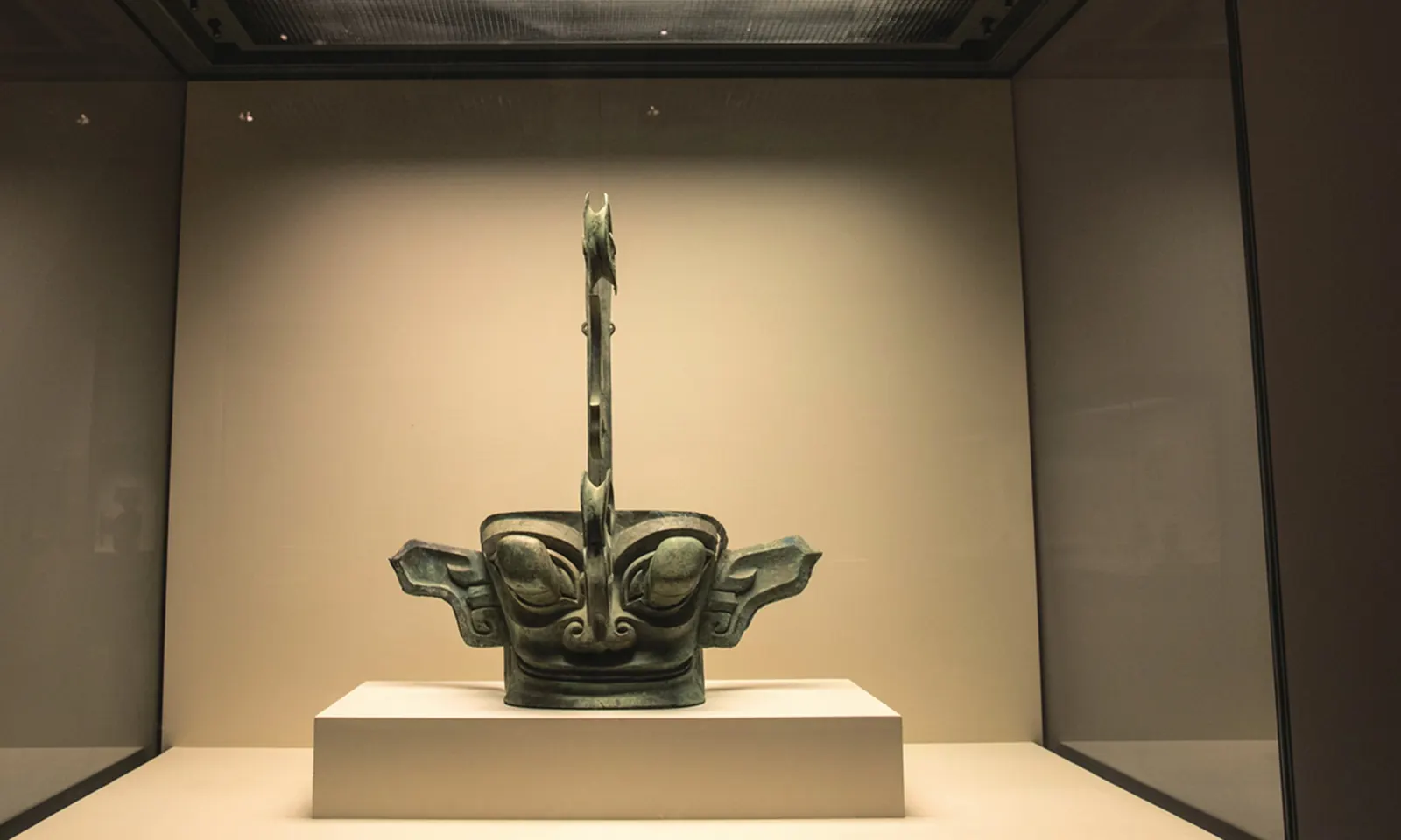 Towering Sanxingdui bronze mask in museum display case